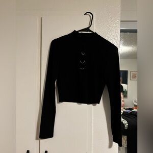 Black long sleeve turtle neck with middle cut, cropped.